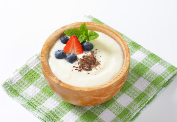 bowl of semolina pudding with fruit
