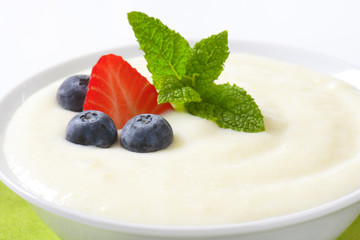 bowl of semolina pudding with fruit