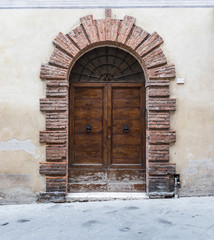 Massive wooden doors typical of southern Italy