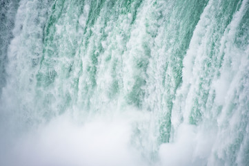 Close up view of the amazing Niagara Falls seen from the Canadian border in Autumn.