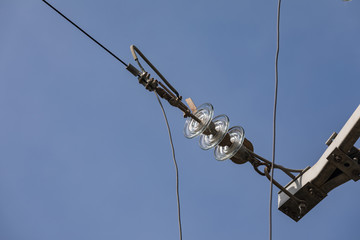 Obraz premium Glass insulator on the power line