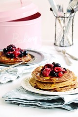 Buckwheat pancakes with berries and honey. Delicious breakfast 