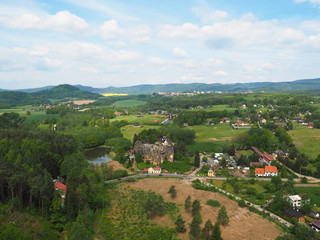 Fototapeta premium CZECH REPUBLIC, SLOUP V CECHACH, MAY 21,2016: View from lookout tower in the village sloup v cechach in luzické hory mountain with mediaval sand stone castle