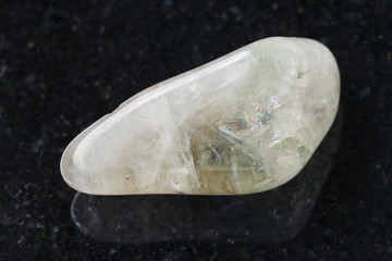 polished Prasiolite (green quartz) stone on dark