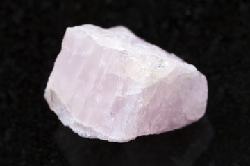raw morganite (pink beryl) crystal on dark