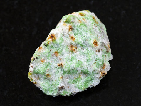 rough Edenite stone on dark background