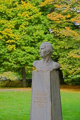 Autumn in central park - art gardener and botanist Vaclav Skalnik´s bust in Marianske Lazne...