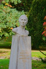 Autumn in central park - bust of art gardener and botanist Vaclav Skalnik in Marianske Lazne...