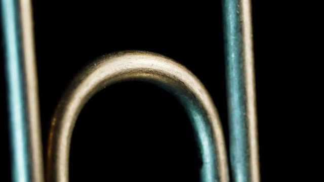 Macro close up, paperclip against background