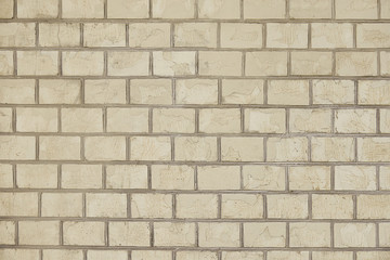Old beige brick wall background texture