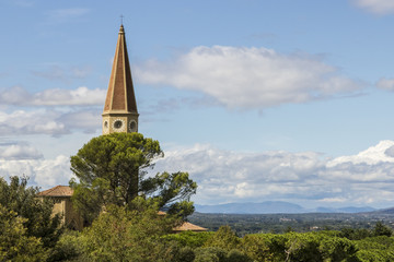 Steeple and clock of church , seen from atop the Medici fortress in Arezzo,Tuscany, Italy