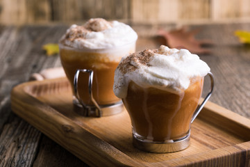Pumpkin spice latte with whipped cream and pie spices