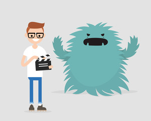 Film set. Horror movie. Big scary monster. Young character holding a retro clapper board. Entertainment industry / flat editable vector illustration, clip art