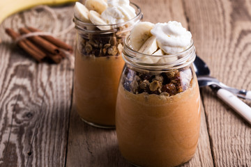 Pumpkin smoothie with granola and bananas