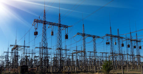 distribution electric substation with power lines and transformers.