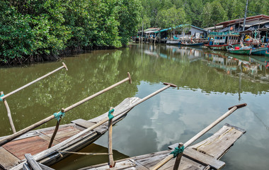 Old wooden boat in the fishing village south-east Asia