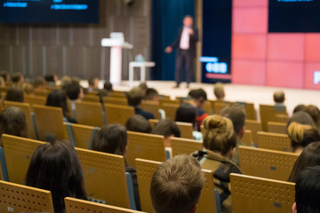 Audience listens to the lecturer at the conference hall
