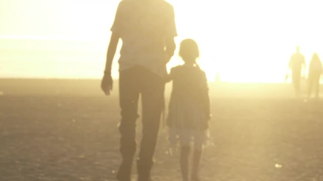 Father and Daughter Walk Hand-in-Hand Silhouette