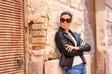 Fashion Portrait of a young woman in decayed European urban neig