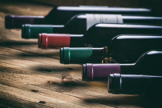 Wine bottles on wooden background