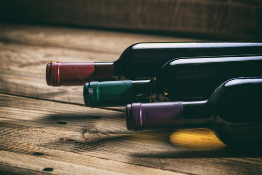 Wine bottles on wooden background