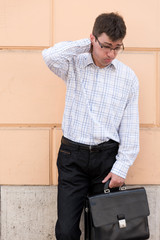 Obraz premium Portrait of a thoughtful and worried business man on the street