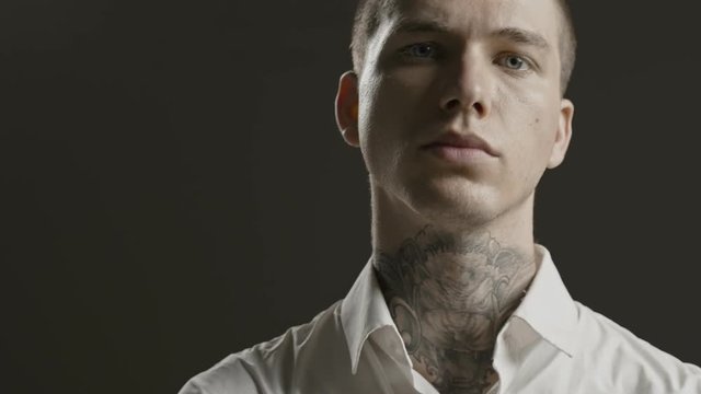 Handsome confident, successful stylish man portrait - neck tattoo - male fashion model - Prores