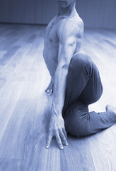Man yoga teacher in gym