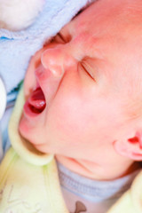 Little newborn sad baby crying