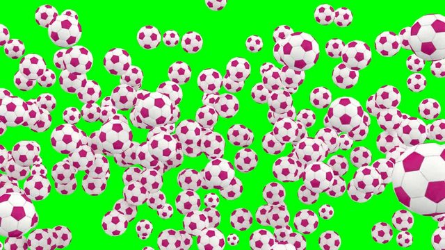 Animated a lot of simple soccer balls with white and pink material dancing, flying or jumping against green background and in slow motion. Front camera view.
