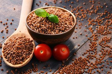 Bowl of buckwheat kasha on wooden table