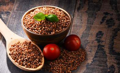 Bowl of buckwheat kasha on wooden table