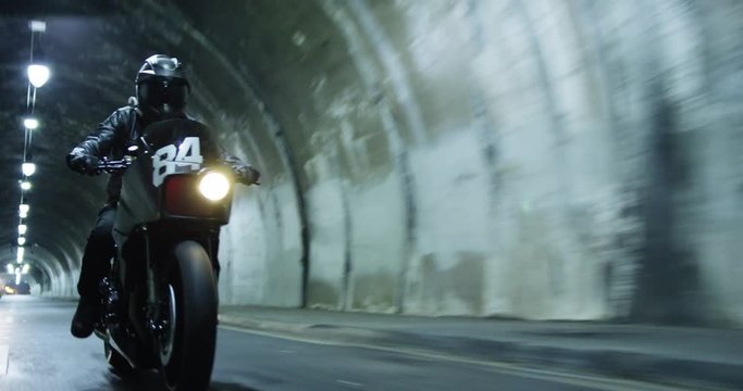 Motorcycle in tunnel, tracking shot