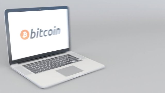 Opening and closing laptop with Bitcoin BTC logo on the screen. Cryptocurrency related clip, blank space for captions or infographics