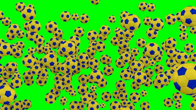 Animated a lot of simple soccer balls with yellow and blue material dancing, flying or jumping against green background and in slow motion. Front camera view.
