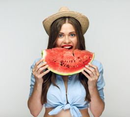 Mexican style wearing  woman eating watermelon.