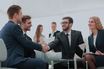 Mature businessman shaking hands to seal a deal with his partner