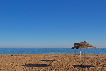 Sun umbrella. Beautiful Spanish beach. Costa del Sol, Andalusia, Spain.