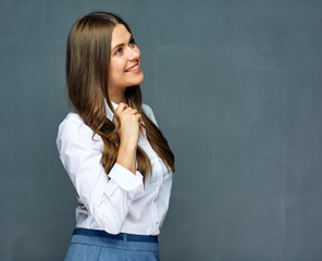 businesswoman wearing white shirt looking side