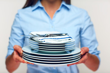 Concept for catering service woman holding plates.