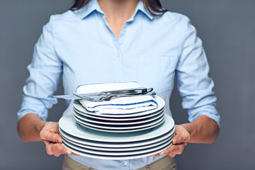 Concept for catering service woman holding plates.