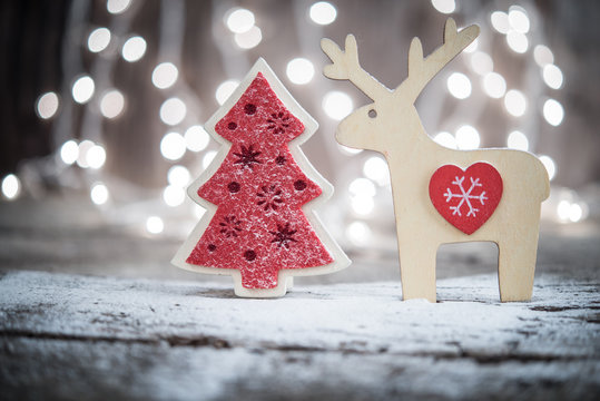 Christmas ornaments over bokeh lights background