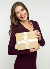 Happy woman holding gift box.