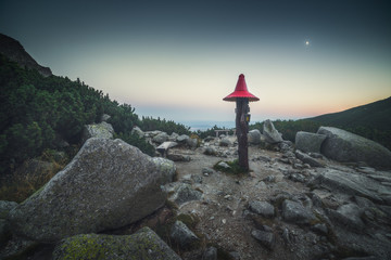 Obraz premium Rest Place with Wooden Sign in Mountains in the Evening in Velicka Valley, High Tatras, Slovakia