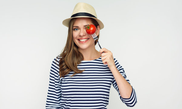 Diet concept portrait with woman and forked tomato.