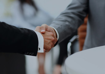 Business people shaking hands over a deal