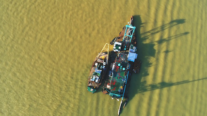 Aerial view. Boats are docked in a group.