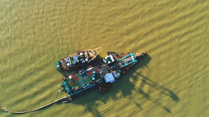 Aerial view. Floating boats in a river.