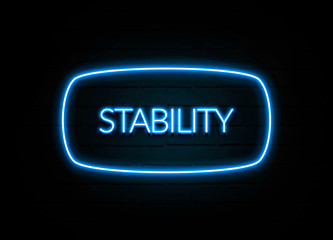 Stability  - colorful Neon Sign on brickwall