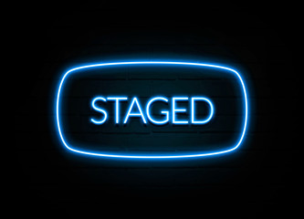 Staged  - colorful Neon Sign on brickwall